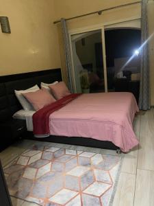 Ένα ή περισσότερα κρεβάτια σε δωμάτιο στο Appartement vue sur mer
