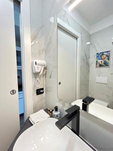 Koupelna v ubytování Monolocale in bicocca + 6 fotografií