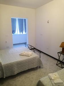 Posteľ alebo postele v izbe v ubytovaní Trulli in Martina Franca residence