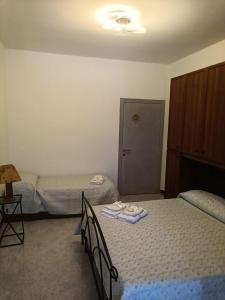 Posteľ alebo postele v izbe v ubytovaní Trulli in Martina Franca residence