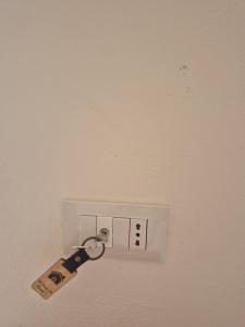 a electrical outlet with a cord plugged into it at A Casa Do Paisi - Realmonte in Realmonte