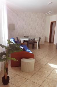a living room with a couch and a table at Leohouse in Casarano