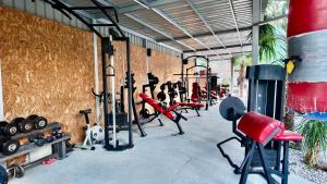 a gym with a bunch of exercise equipment in it at Apartments Ljiljanic in Budva