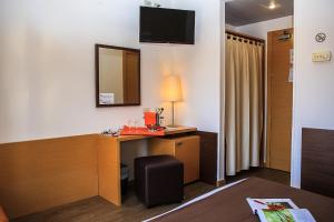 TV a/nebo společenská místnost v ubytování Hotel Sisto V
