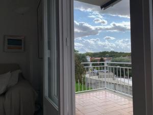 an open door to a balcony with a view at Girona m'enamora in Girona