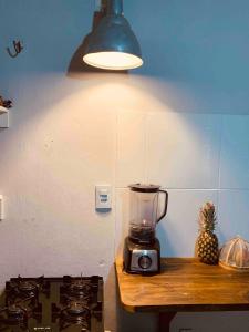 a blender sitting on a counter next to a stove at Casa Indigo Blue Jeri in Jericoacoara