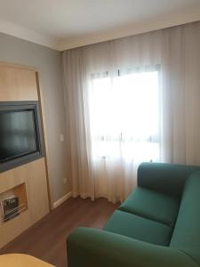 TV a/nebo společenská místnost v ubytování Flat em pinheiros equipado em hotel 4 stat