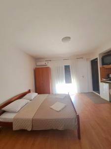 Postel nebo postele na pokoji v ubytování Lazorja Rooms + 15 fotografií
