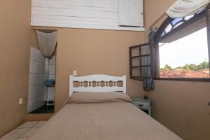 Postel nebo postele na pokoji v ubytování Casa Aconchegante com Churrasqueira