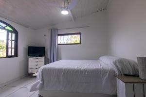 Postel nebo postele na pokoji v ubytování Casa Aconchegante com Churrasqueira + 7 fotografií