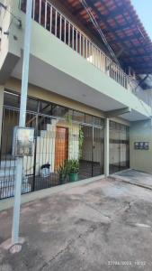 an outside view of a building with a fence at Studio Figueira, Flor in Santarém