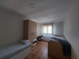 Postel nebo postele na pokoji v ubytování Agro dos Mouriños + 13 fotografií