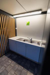 a bathroom with a sink in a room at Barbana Lipizzans Camper Park - Pitches for Campers and Tents in Radovljica