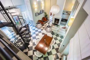 an overhead view of a living room with a staircase at A Majestic Oasis in Keramikos, the Heart of Athens in Athens