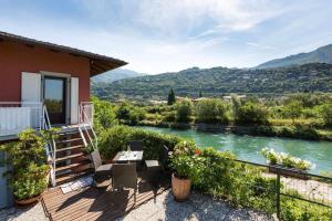 a house with a view of a river at Torbole Holiday House in Nago-Torbole