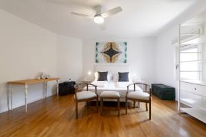 a dining room with a table and two chairs at Torbole Holiday House in Nago-Torbole +41 photos