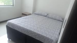 Postel nebo postele na pokoji v ubytování Amplio apartamento con ubicación inmejorable