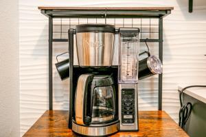 a blender sitting on top of a counter at Earthy Pearl 1 Bedroom Suite at the Boise Depot in Boise +14 photos
