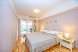 Posteľ alebo postele v izbe v ubytovaní Apartments Talija Podgora