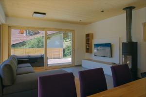 a living room with a couch and a table at Chalet Tonin in Fulpmes