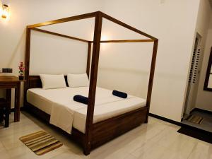 Katil atau katil-katil dalam bilik di Alice Rest Arugambay