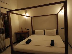 Katil atau katil-katil dalam bilik di Alice Rest Arugambay