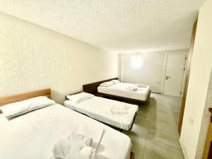 Letto o letti in una camera di Hotel Barbare