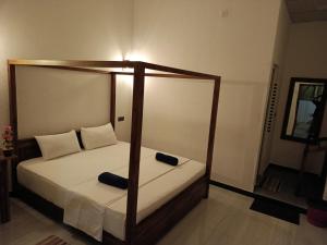 Katil atau katil-katil dalam bilik di Alice Rest Arugambay