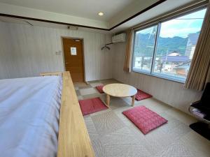 Postel nebo postele na pokoji v ubytování Yuzawa house2
