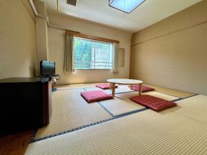 Postel nebo postele na pokoji v ubytování Yuzawa house2 + 37 fotografií