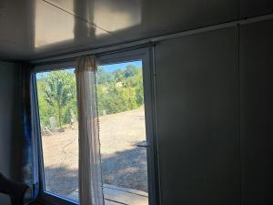 a window in a room with a view of a field at Farm house in Kelso +11 photos