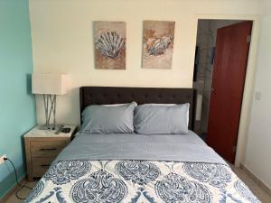Postel nebo postele na pokoji v ubytování Cozy apartment in Savaneta