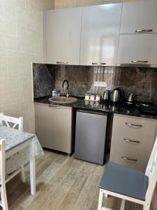 Kuchyň nebo kuchyňský kout v ubytování Villa Platinum