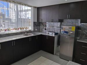 Kuchyň nebo kuchyňský kout v ubytování Residence FasMin B&B Nayon experience boxing