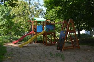 a playground with a slide in a park at Zelenyi Kampus in Odesa