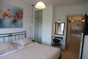 Olive Garden Villas and Apartments客房内的一张或多张床位