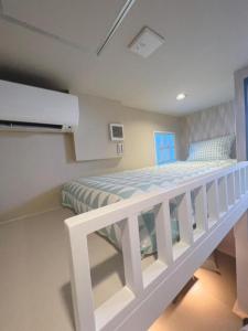 Postel nebo postele na pokoji v ubytování 誠家　MAKOTO HOSTEL