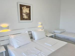A bed or beds in a room at Vavanos Studios