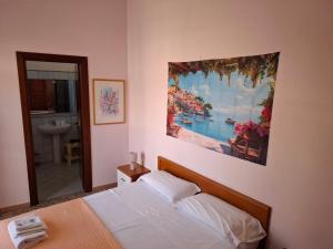 Posteľ alebo postele v izbe v ubytovaní B&B Batarà - "La Terrazza del Centro"