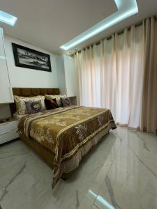 Postel nebo postele na pokoji v ubytování Aube Hivernage appartement + 16 fotografií