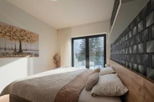Posteľ alebo postele v izbe v ubytovaní 3D Park Living Apartment