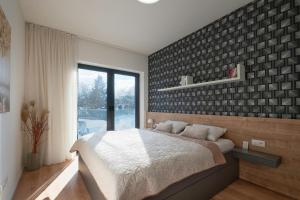 Posteľ alebo postele v izbe v ubytovaní 3D Park Living Apartment