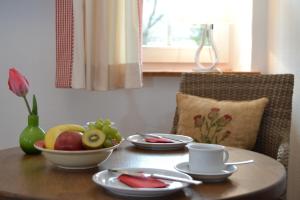 a table with a bowl of fruit on top of it at Feldmann-Schütte in Schmallenberg +8 photos