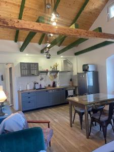 a kitchen with a table and a dining room at Mila in Olib +32 photos