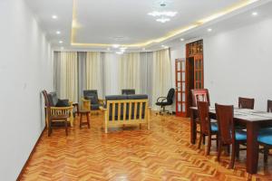 a dining room with a table and chairs at Large Villa with Driver Included in Addis Ababa +59 photos