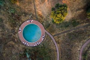 an aerial view of a swimming pool in a field at Monte das Casolas in Grândola