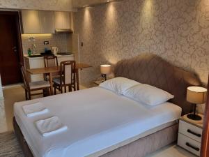 Postel nebo postele na pokoji v ubytování Apartments Daki