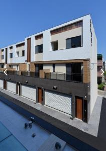 an external view of a building with balconies at Beautiful Villa in Shanhua