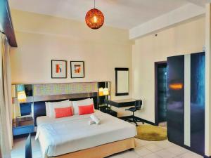 Postel nebo postele na pokoji v ubytování Seri Residence Suites Kuala Lumpur + 6 fotografií