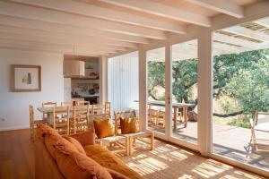 a living room with a couch and a table at Monte das Casolas in Grândola